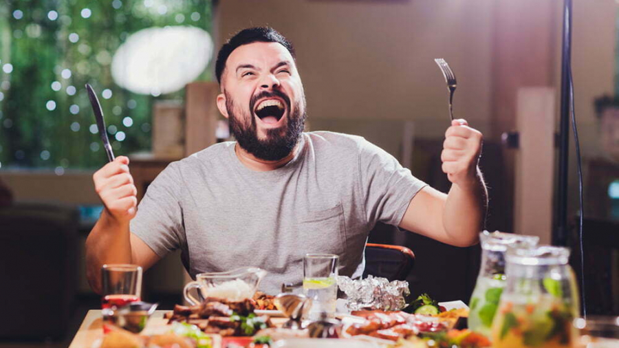 man at the big table with food