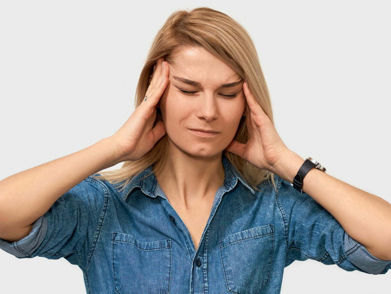 indoor-portrait-exhausted-young-female-touching-her-head-with-closed-eyes-posing-white-studio-background-business-woman-suffering-from-migraine-people-business-health-concept