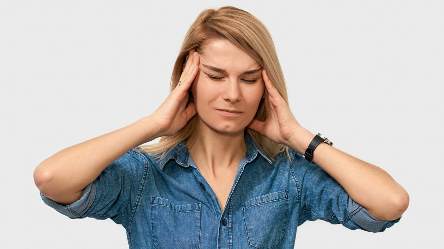 indoor-portrait-exhausted-young-female-touching-her-head-with-closed-eyes-posing-white-studio-background-business-woman-suffering-from-migraine-people-business-health-concept