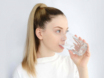 young-pretty-woman-drinks-water