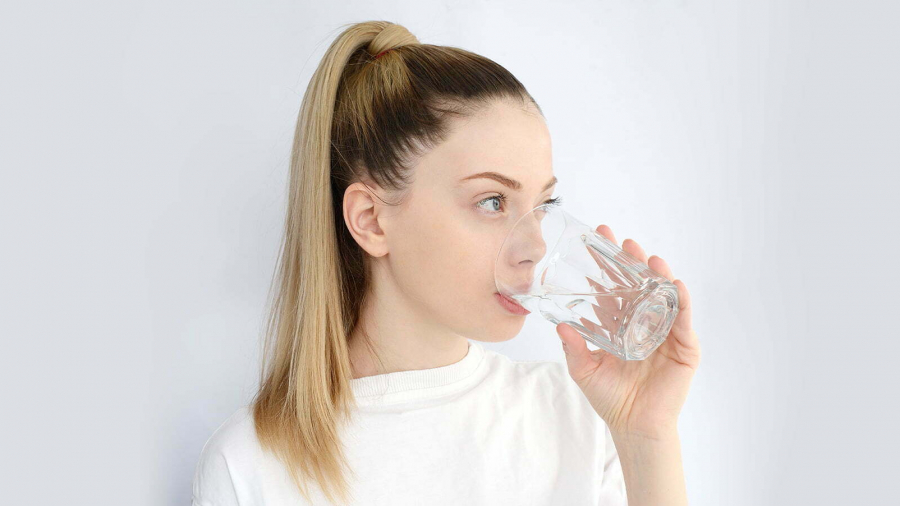 young-pretty-woman-drinks-water